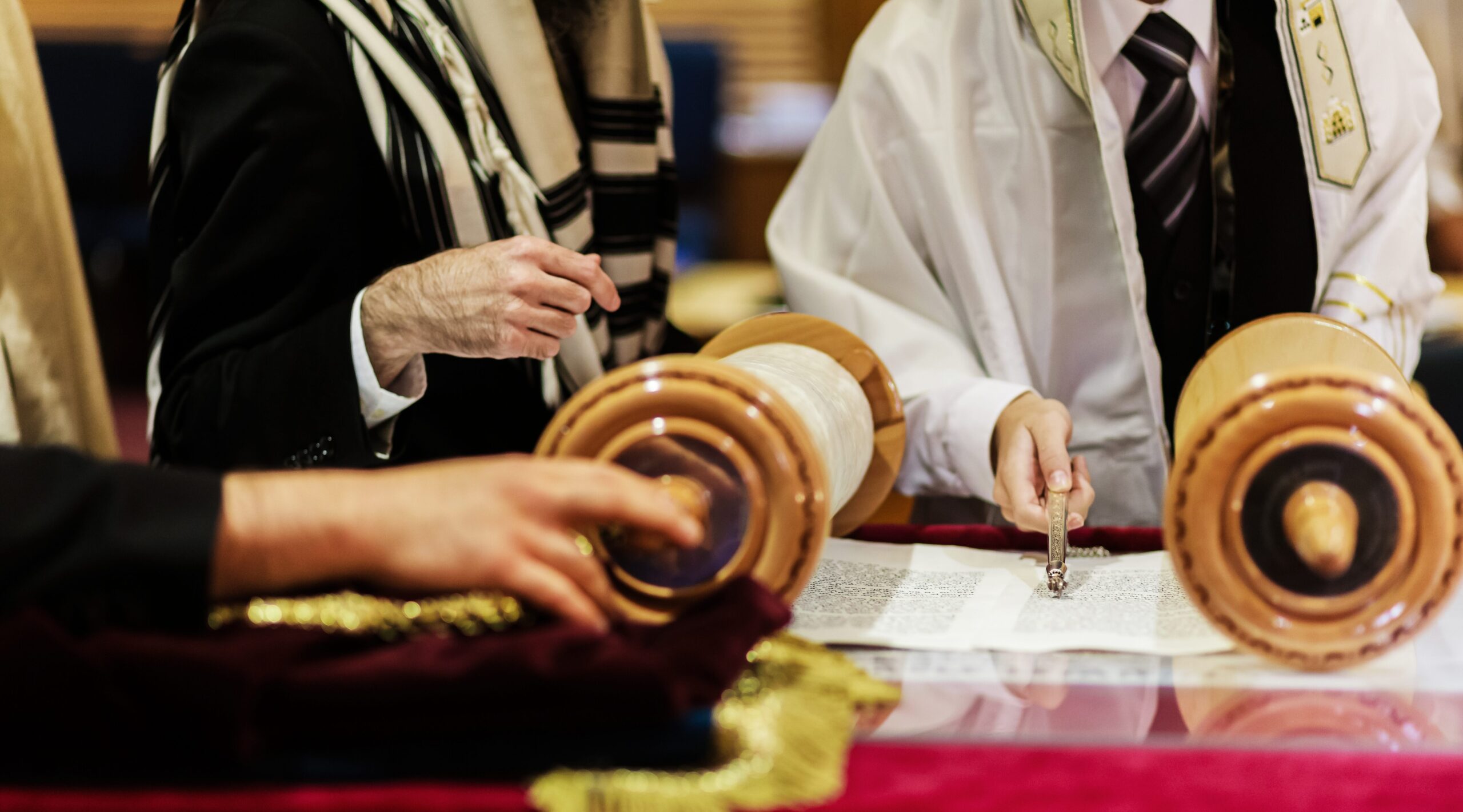 65716962247C65B43E654D1C Hand Of Boy Reading The Jewish Torah At Bar Mitzva 2023 11 27 04 53 56 Utc 1 Scaled Mitzvahs